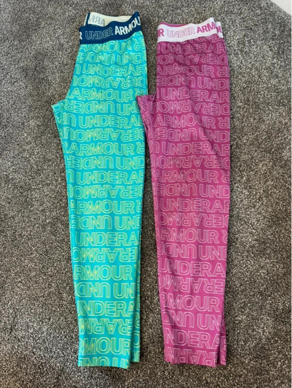 Two pairs of girlβs Under Armour leggings heat gear Medium